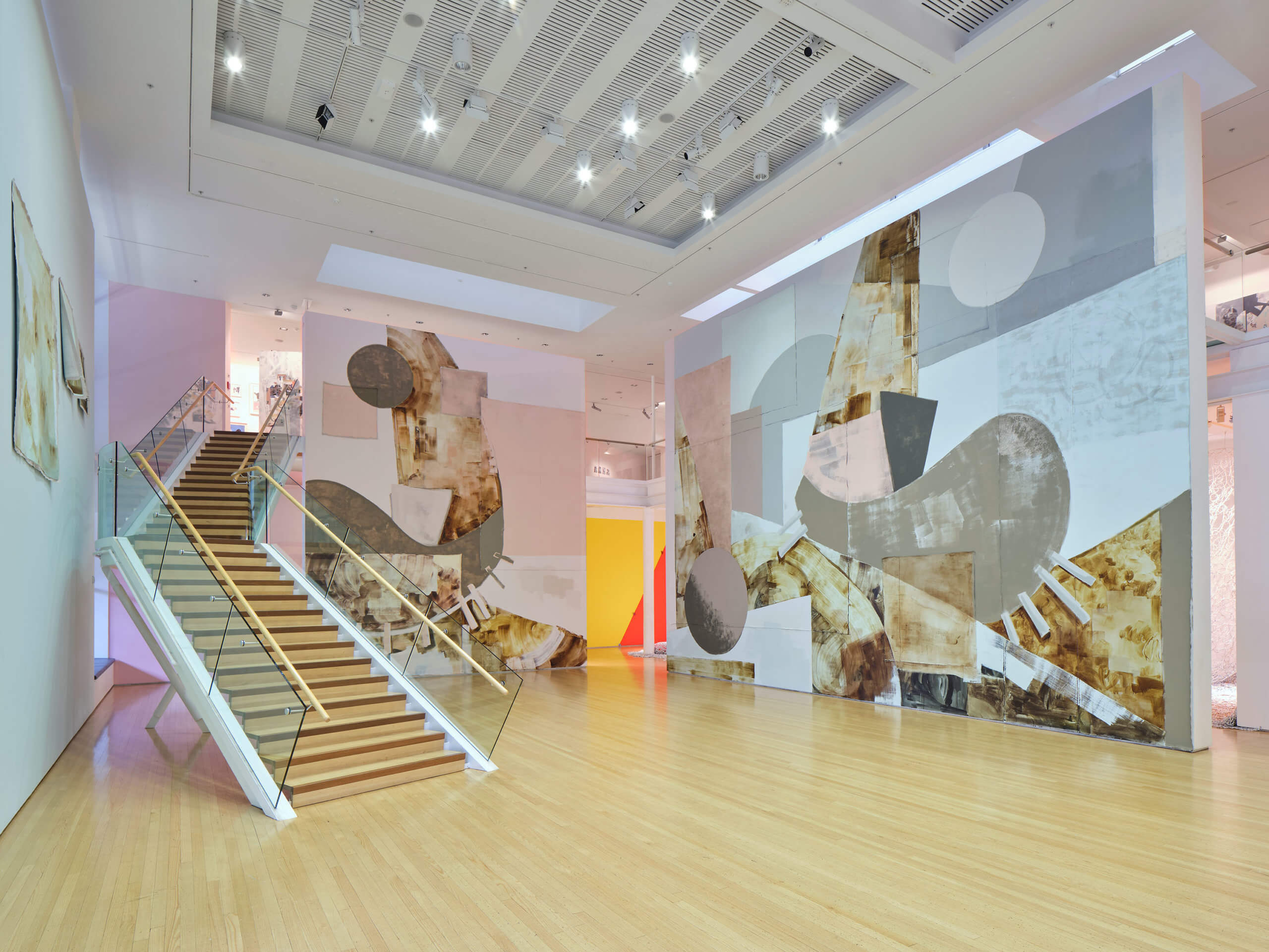A view of Tauranga Art Gallery - staircase and large walls with painted installation.